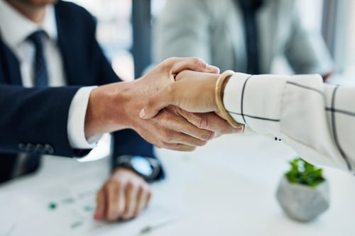 Bad example: business people shaking hands