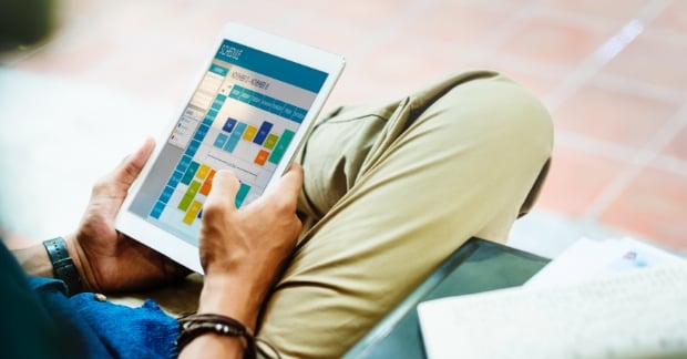 Man reviewing digital social calendar