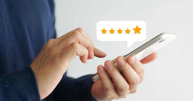 man on phone with a review pop-up showing 5 stars